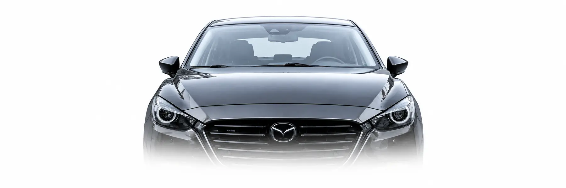 Front view of a Meteor Grey third-generation Mazda3 fading into a white background