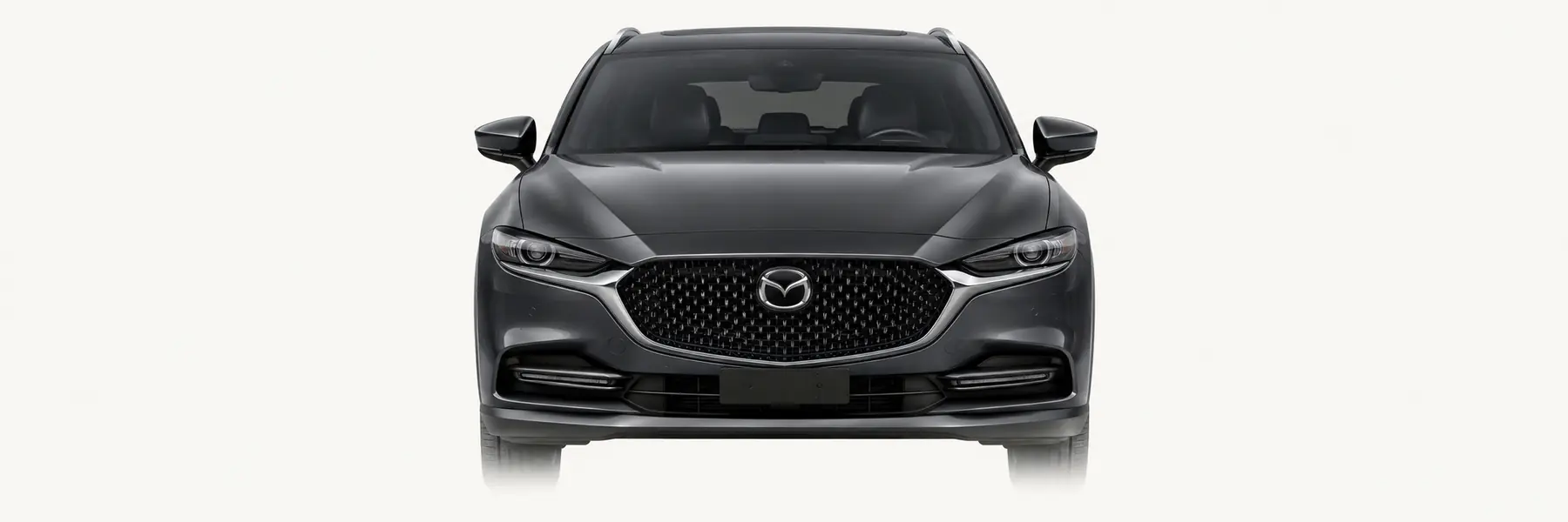 Front view of a graphite Mazda CX-4 fading into the page background