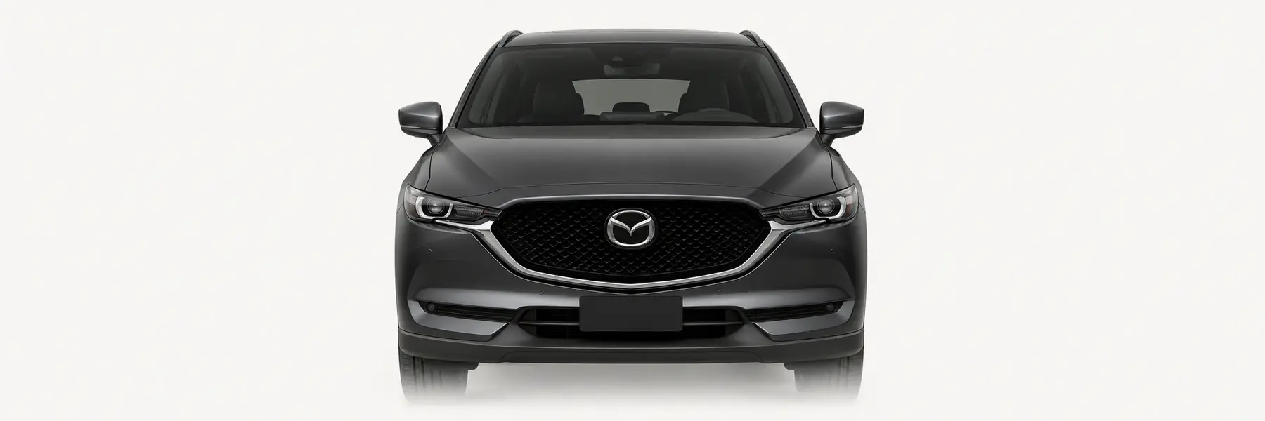 Front view of a graphite Mazda CX-5 KF fading into the page background