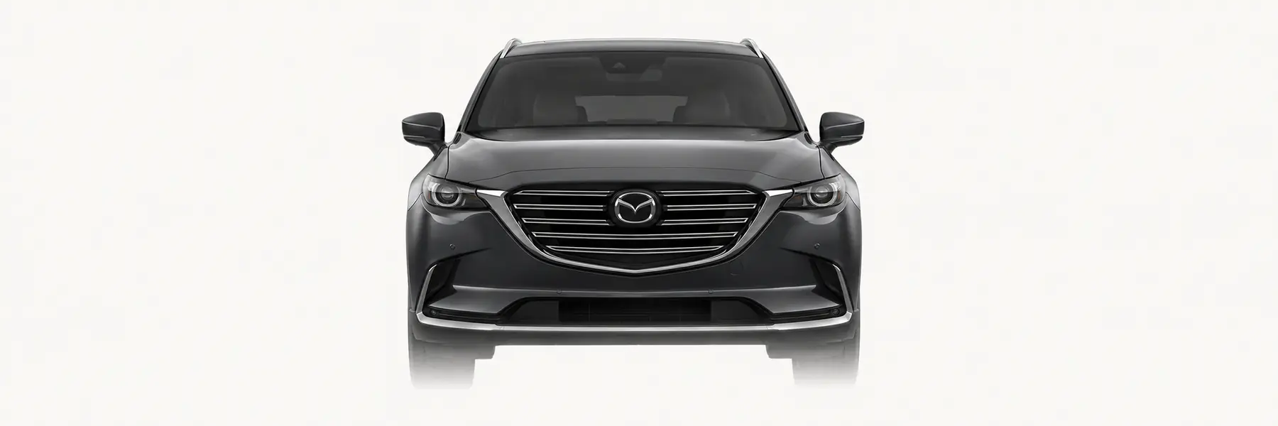 Front view of a graphite Mazda CX-9 TC fading into the page background