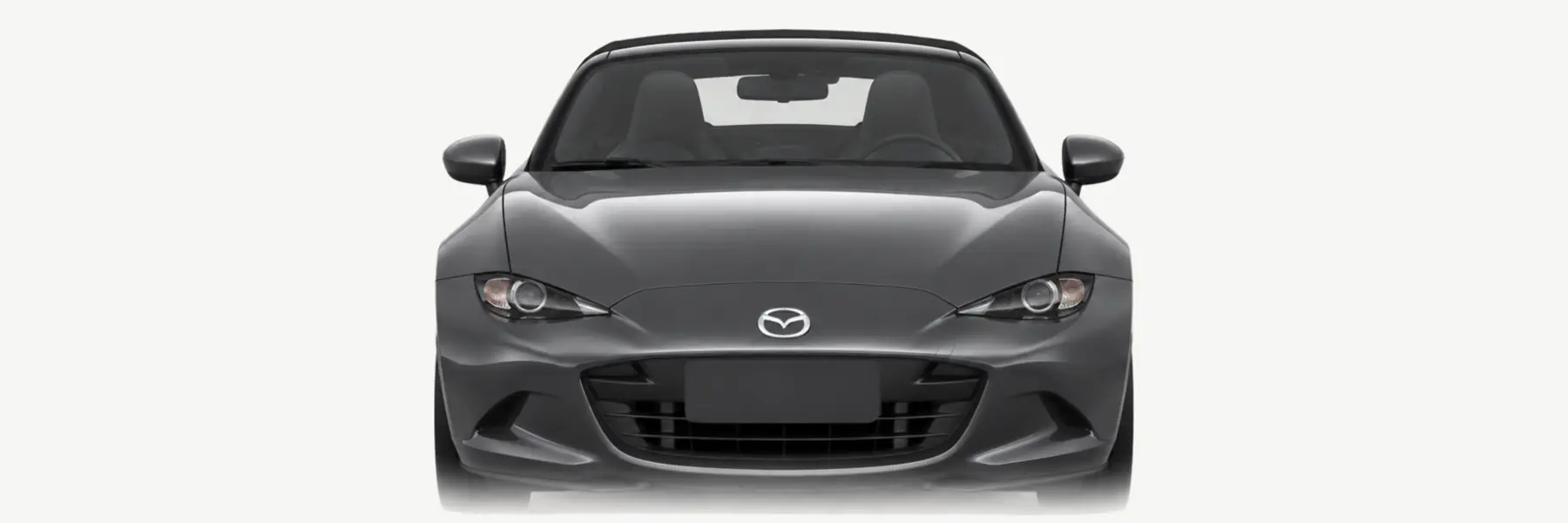 Front view of a graphite Mazda MX-5 ND fading into the page background