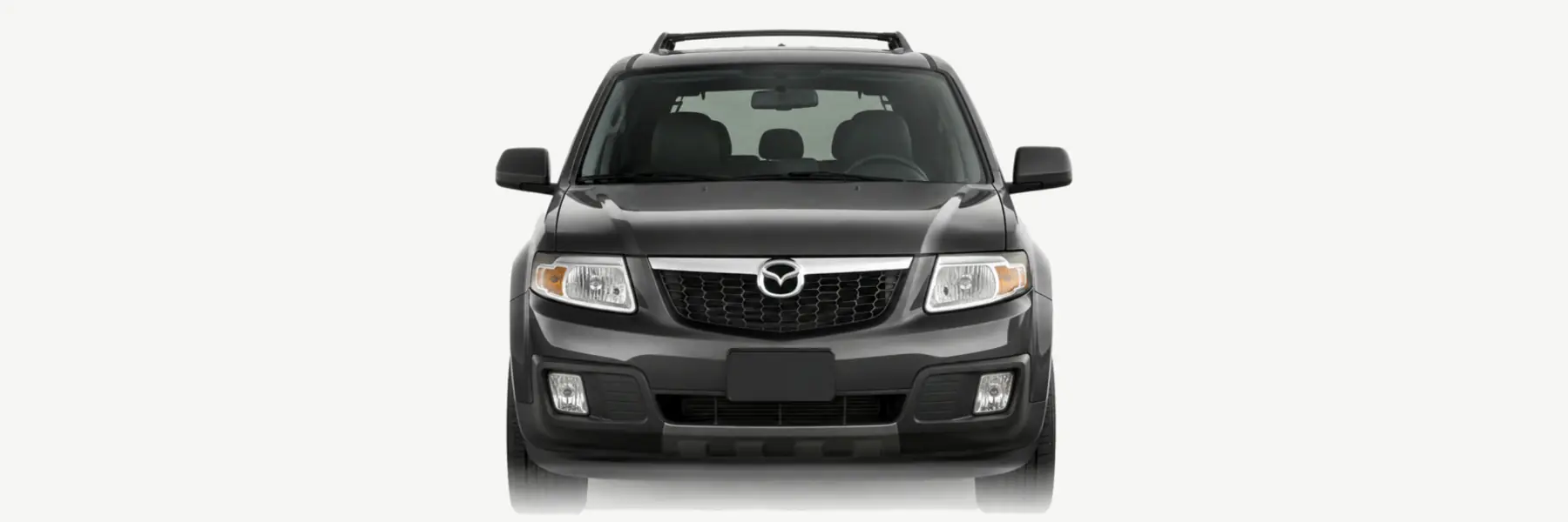 Front view of a graphite second-generation Mazda Tribute fading into the page background