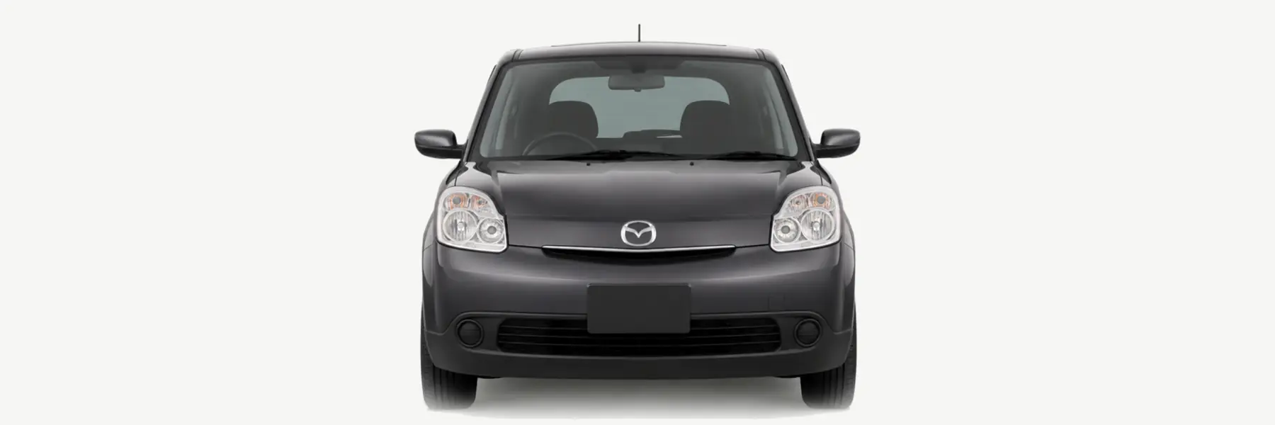 Front view of a graphite Mazda Verisa fading into the page background