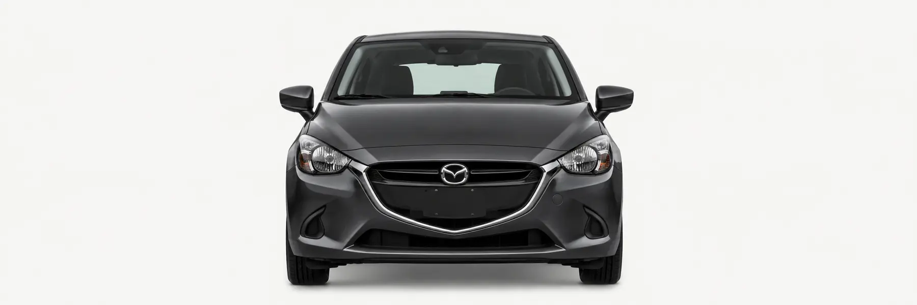 Front view of a graphite Mazda2 and Demio DJ fading into the page background