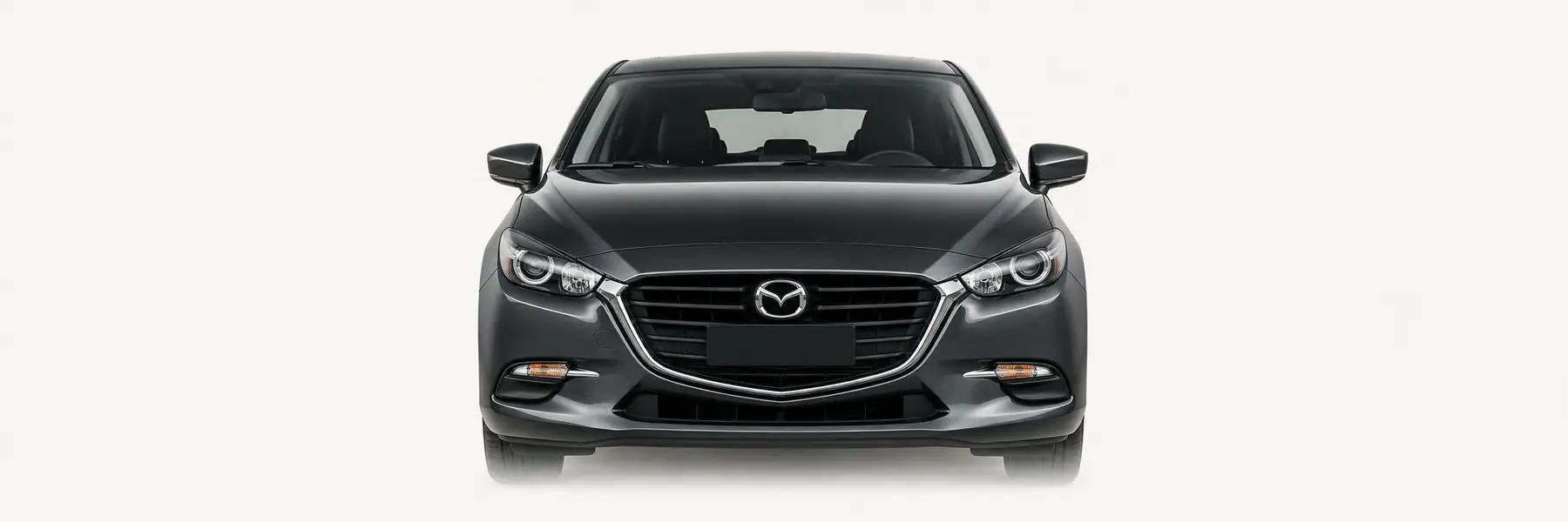 Front view of a graphite third-generation Mazda3 fading into the page background